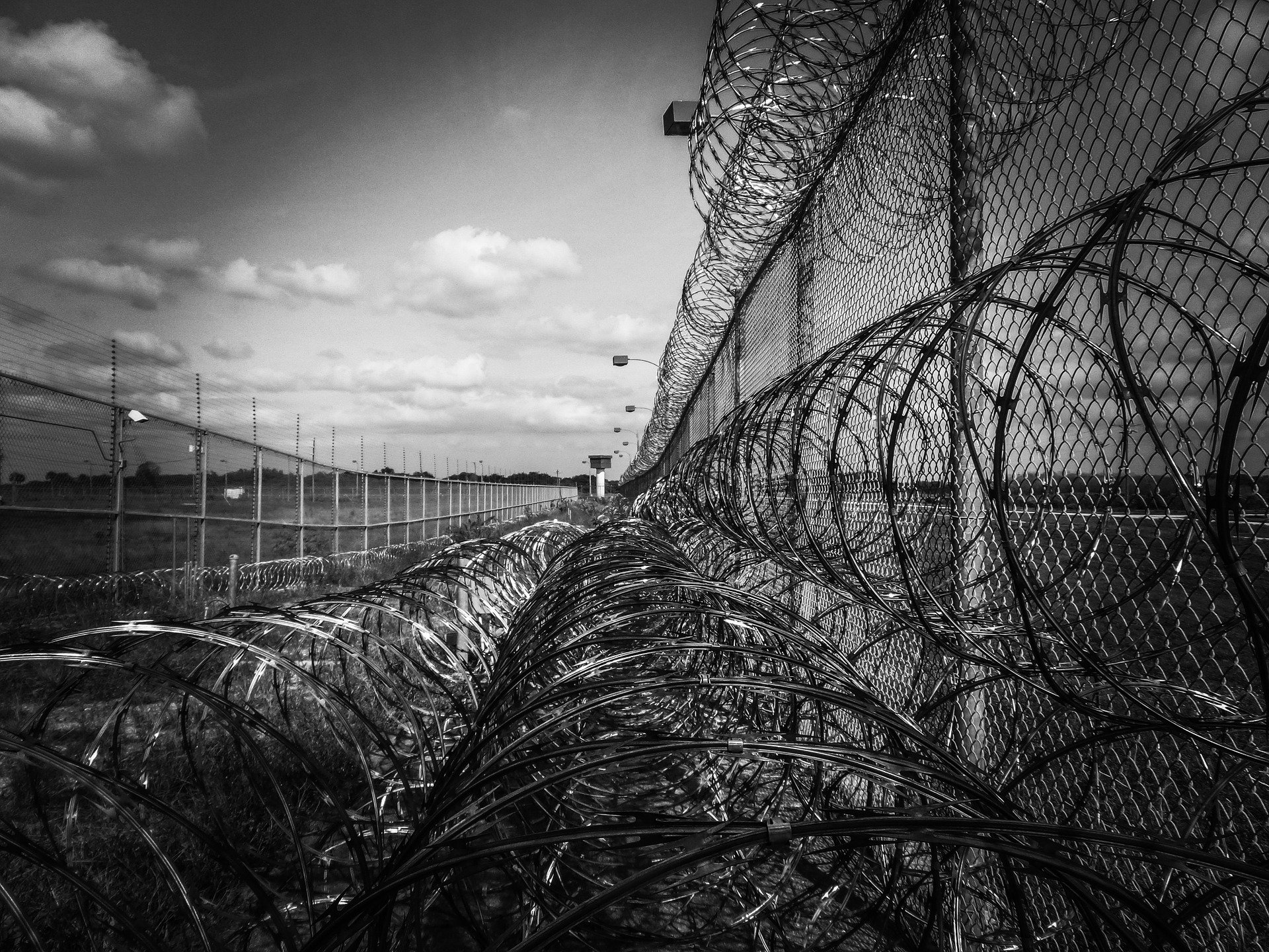 prison fence 219264 1920